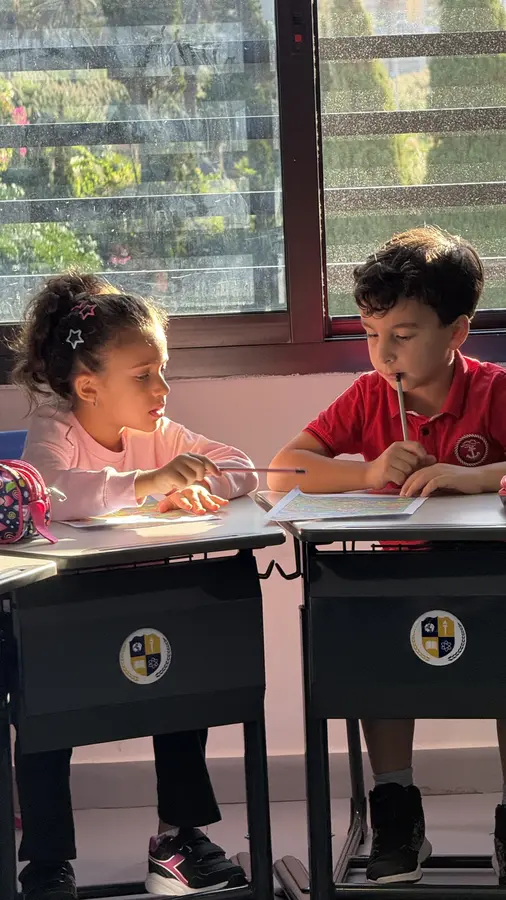 Young learners working together in class