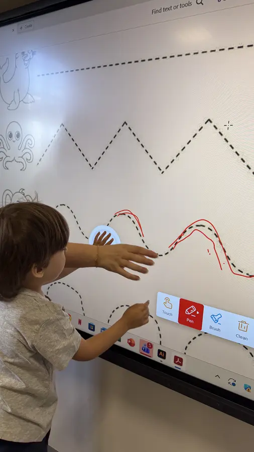 Student using an interactive board